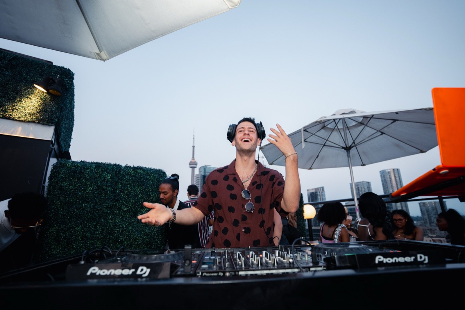 TALMOR with hands up at the decks at Lavelle rooftop