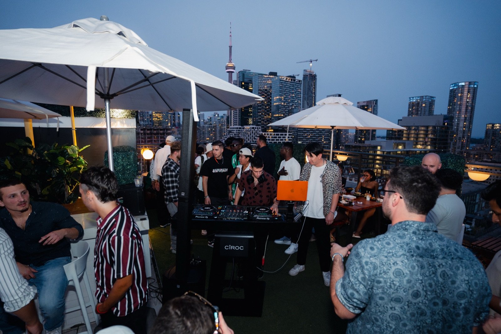 Wide view of the Lavelle rooftop crowd with the Toronto skyline